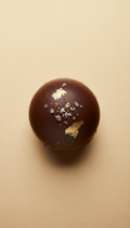 Salted caramel truffle with gold leaf